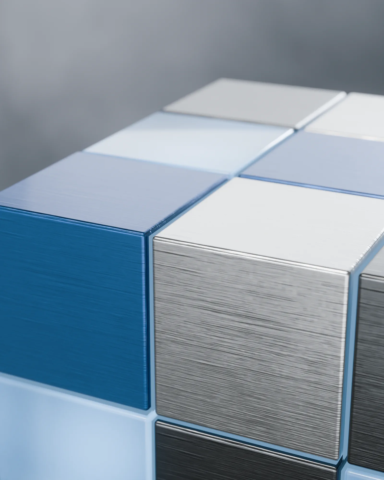 Smoked glass set against brushed aluminium, very close.